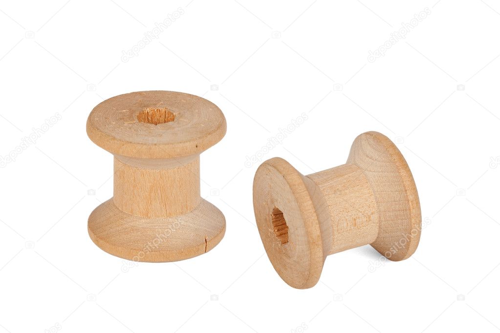 Two old wooden spools from the thread, isolated on a white background