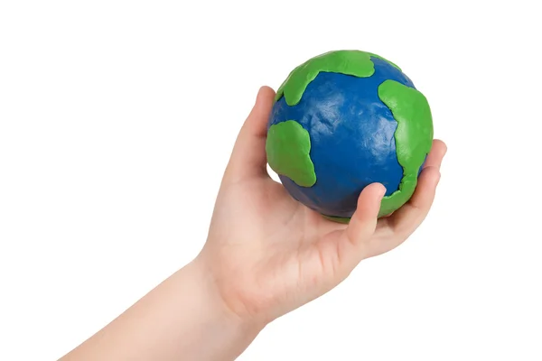 Child's hand holding a globe — Stock Photo, Image