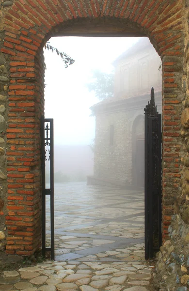 stock image Entrance to foggy town