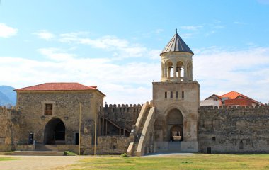 Yard and bell tower of Svetitskhoveli Cathedral in Mtskheta, Georgia clipart