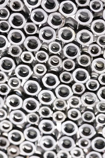 stock image Steal screws and nuts on mirror background