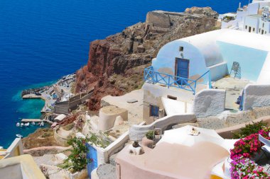Colorful architecture in Santorini with Aegean sea clipart