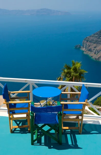 Blue chairs and table in Santorini — Stock Photo, Image