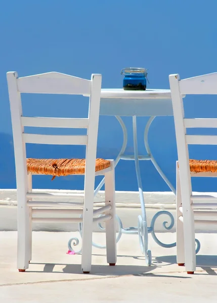 stock image White chairs in Santorini