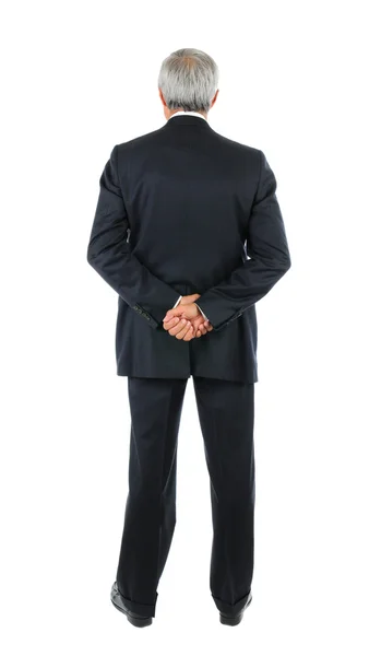 Affärsman med händerna bakom ryggen — Stockfoto