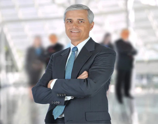 Businessman arms crossed in Lobby — Stock Photo, Image