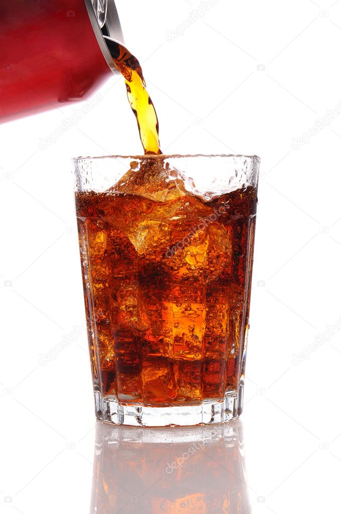 Cola pouring from a can into a glass.