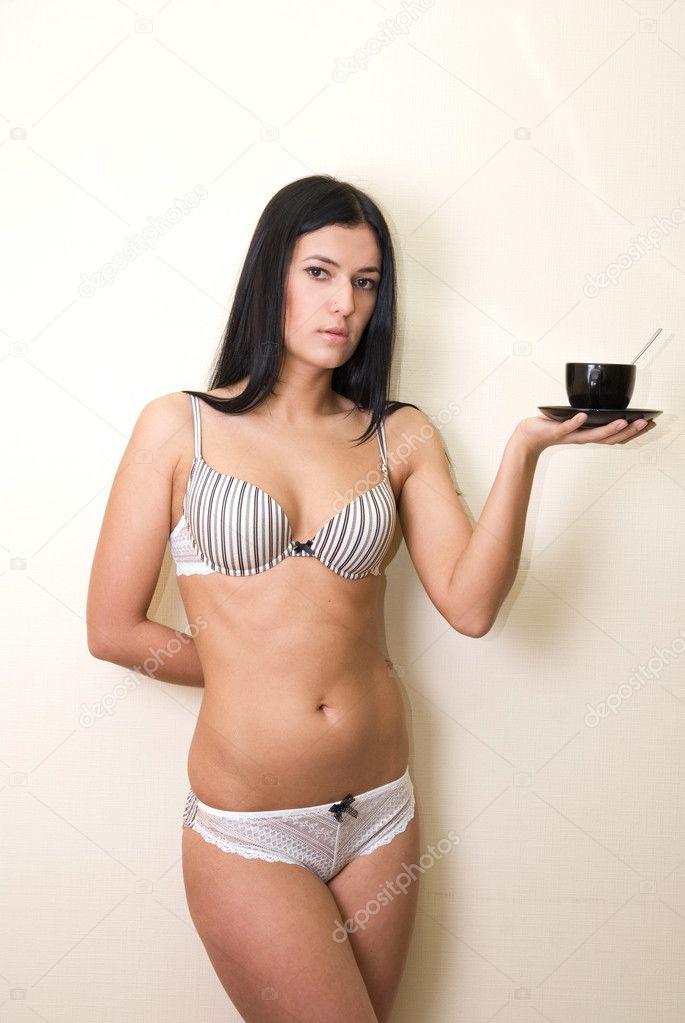Sexy girl in lingerie with coffee cup