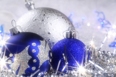 Christmas card with blue and silver ornaments clipart