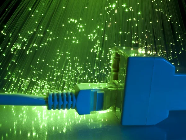 Cerradura y cable de red con fondo de fibra óptica —  Fotos de Stock