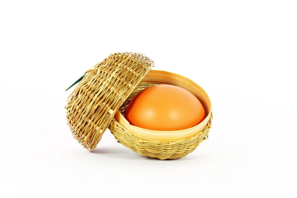 Egg in a little basket — Stock Photo, Image