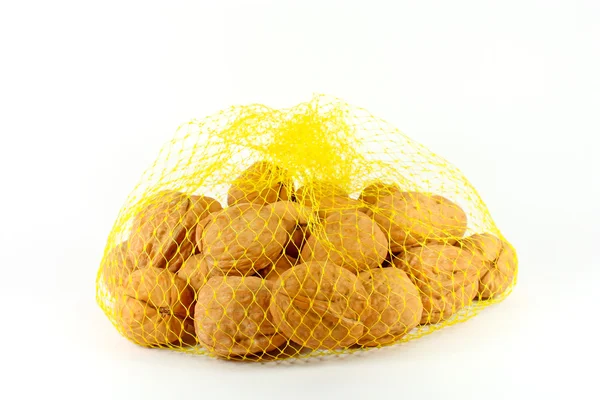 Vlašské ořechy v síti — Stock fotografie