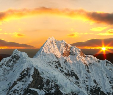 Alpamayo peak on sunset clipart