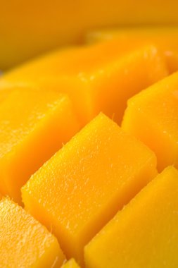 Mango cut and cubed in its skin. clipart