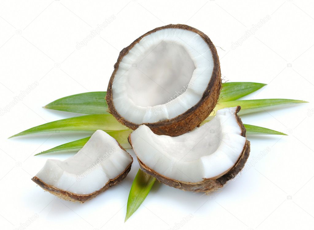 Coconut with leaves closeup on a white background