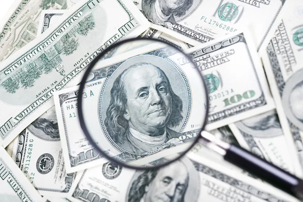 Magnifying glass and dollar — Stock Photo, Image