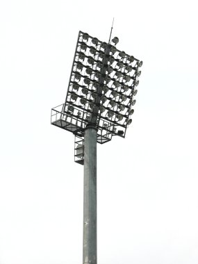 Big spotlights lighting tower at an stadium clipart