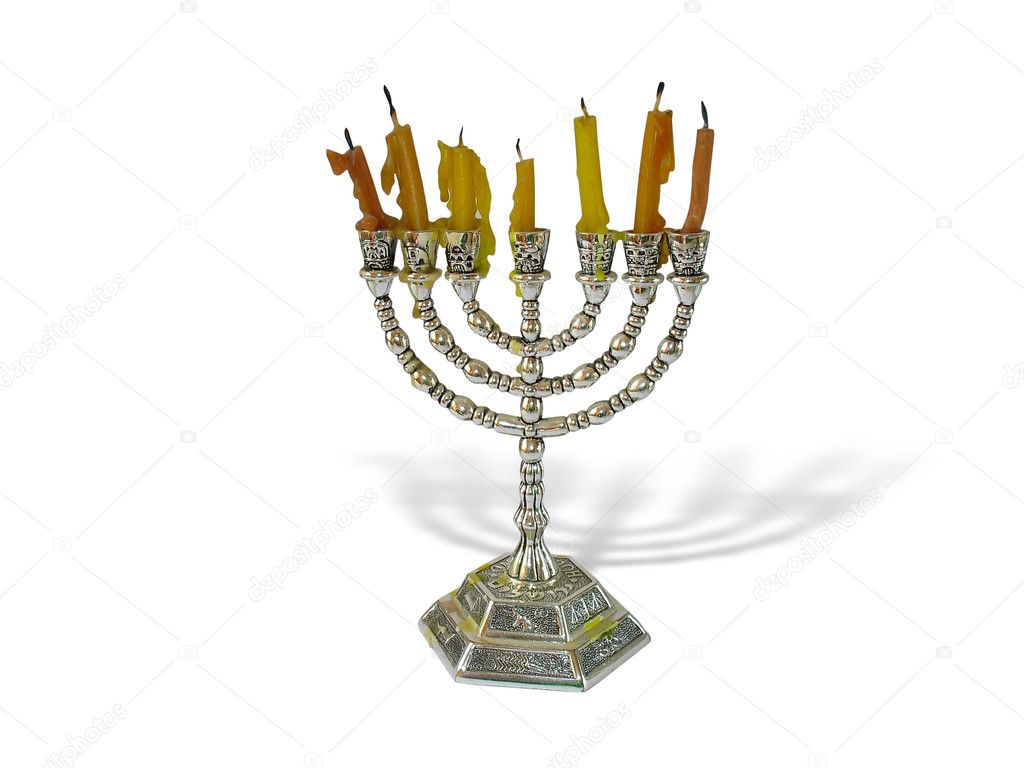 Hanukkah candles in a menorah on white background