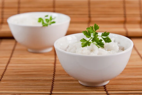 stock image White steamed rice in a white bowl