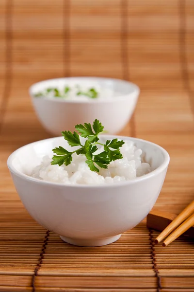 stock image White steamed rice in a white bowl