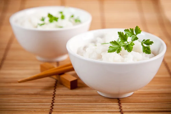 stock image White steamed rice in a white bowl