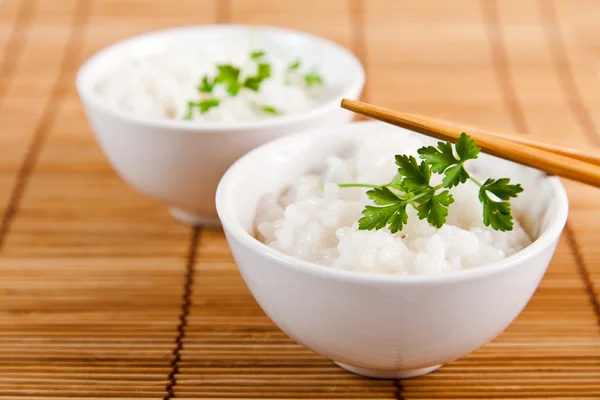 stock image White steamed rice in a white bowl