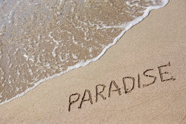 Paradise skriven på sanden — Stockfoto