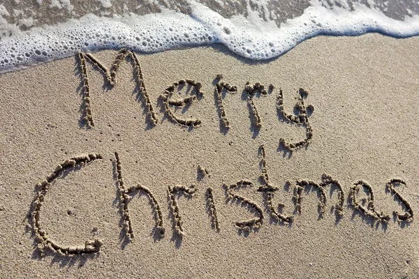 Boldog karácsonyt a homokba írva Jogdíjmentes Stock Fotók
