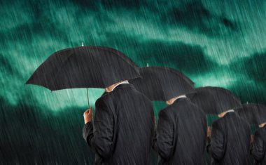 Businessmen in rain clipart
