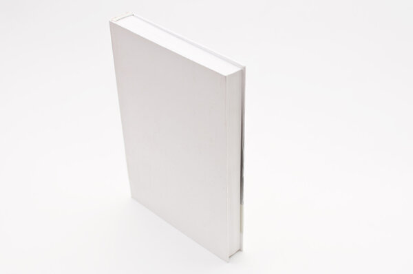 Blank white cover book over a white background
