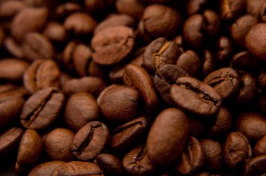 Beautiful brown coffee beans, close up image clipart