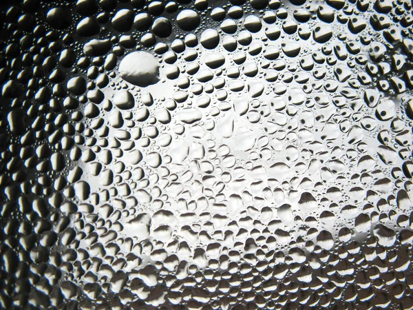 Wassertropfen auf das Glas. Hintergrund — Stockfoto