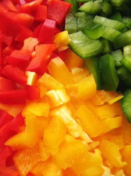 stock image Yellow, red and green peppers Bulgarian. Slicing. Cubes