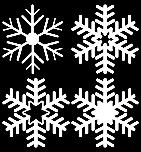 Set di quattro fiocchi di neve isolati su nero — Vettoriale Stock