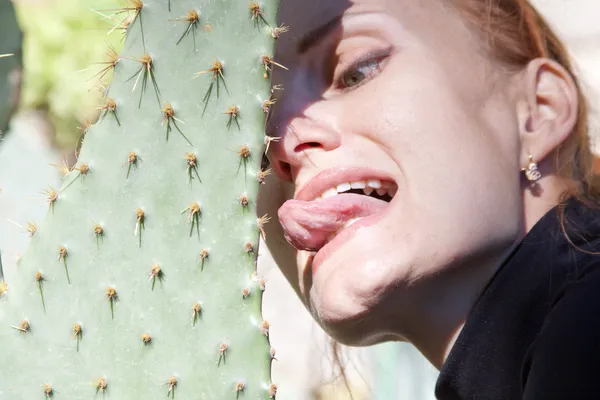 stock image Man touching cactus