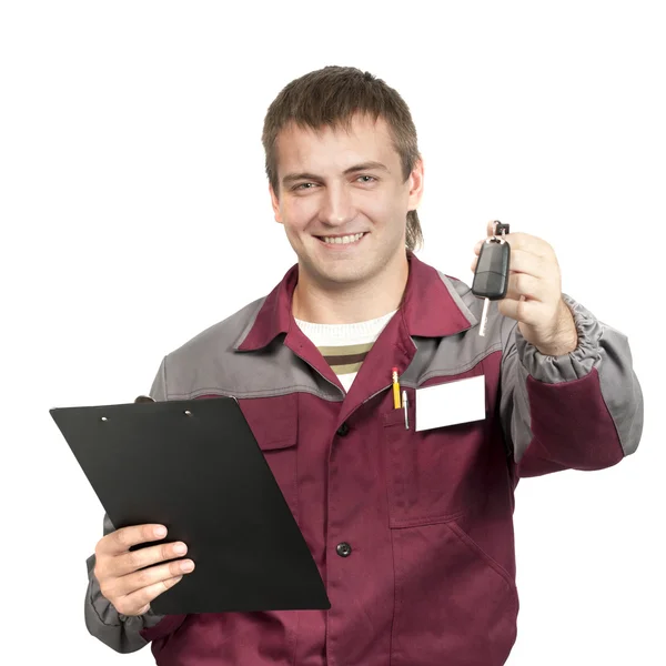 Mechanic giving a car key — Stock Photo, Image