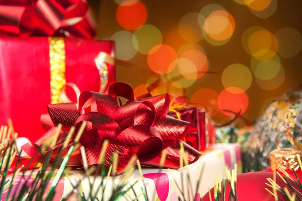 Holiday gifts and blurred lights — Stock Photo, Image
