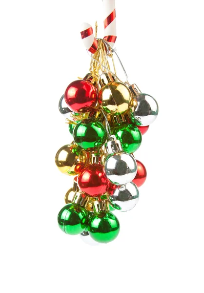 Christmas ornaments hanging on candy cane — Stock Photo, Image