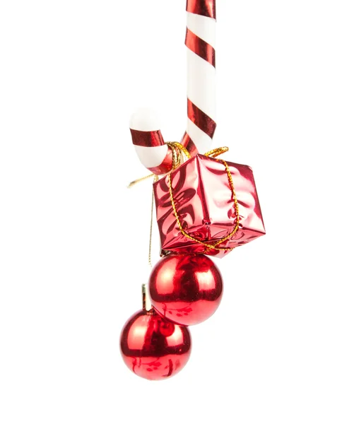 Christmass ornaments hanging on candy cane — Stock Photo, Image