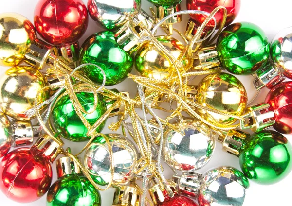 Many small colorful Christmas ornaments — Stock Photo, Image