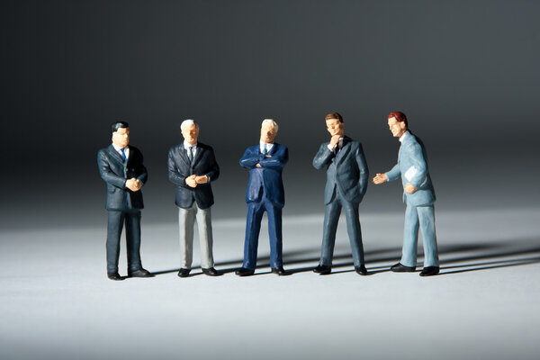 Miniature figurines of successful business team