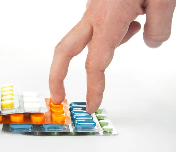 Séta kéz a színes gyógyszerek lépcsők — Stock Fotó