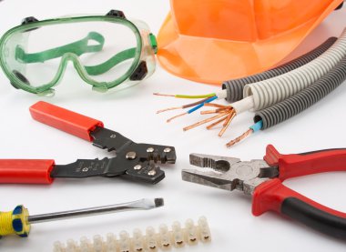 Electrician's tools. Hardhat, pliers, cables, cutter, screwdriver, etc. clipart