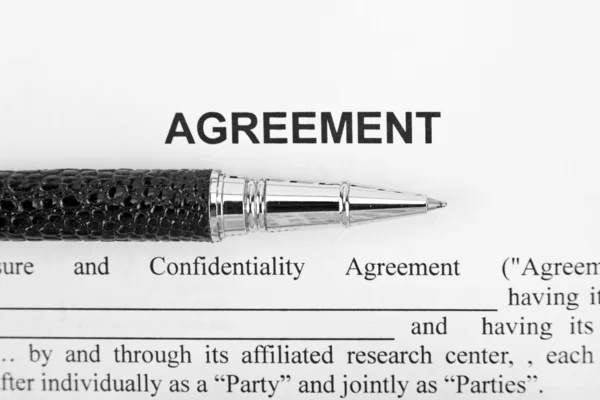 Dohoda a černé pero — Stock fotografie