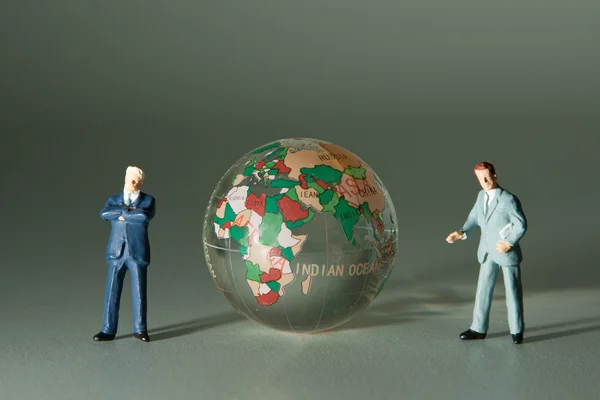 Figurines Two Businessmen Glass Globe — Stock Photo, Image