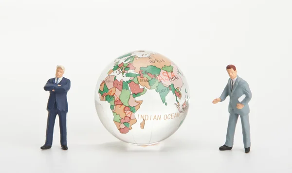 Businessmen and glass globe — Stock Photo, Image