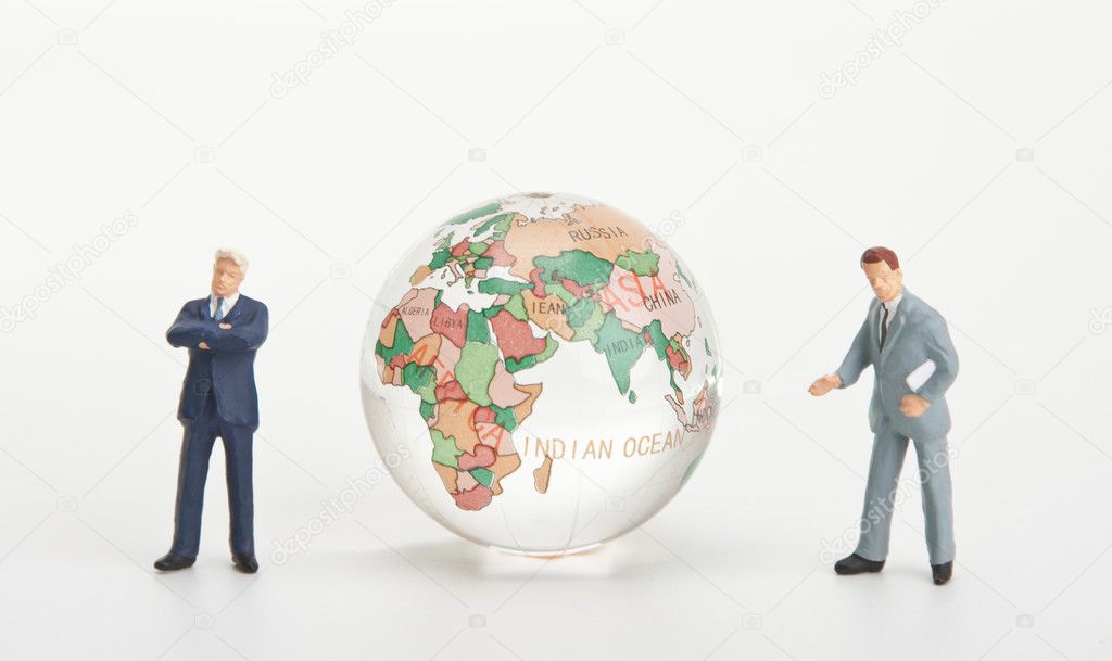 Businessmen and glass globe