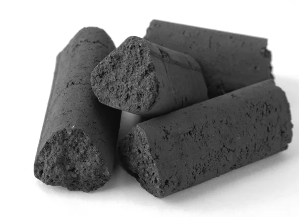 Stückchen Geformter Schwarzer Kohle Auf Weißem Hintergrund — Stockfoto