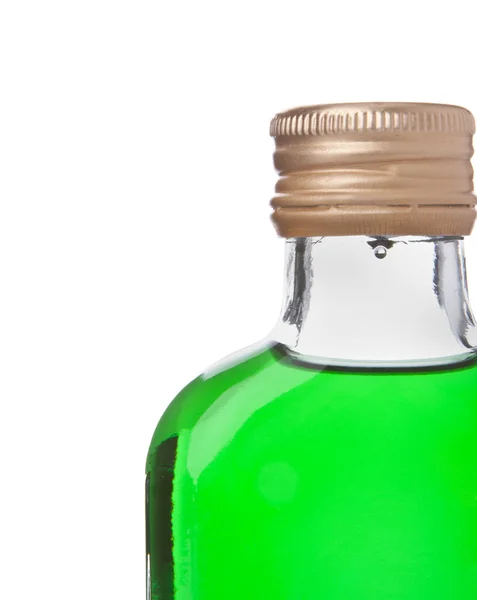 Fles met groene alcohol — Stockfoto
