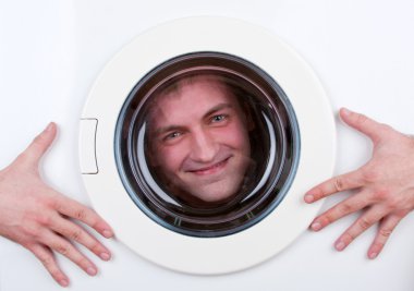 Happy man inside washing machine clipart